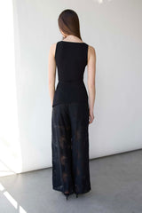 FITTED SLEEVELESS TOP WITH ASYMMETRICAL HEM