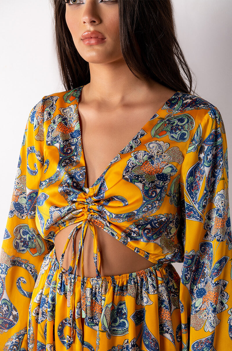 ADMIT IT LONG SLEEVE PRINTED ROMPER WITH CUT OUT