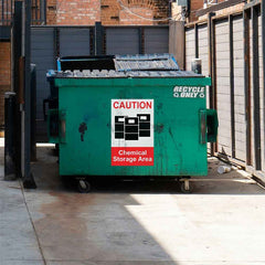 24x36 inch Chemical Storage Sign Wall Decal Installed on Dumpster